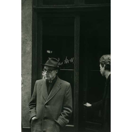 Brion Gysin, William Burroughs in front of the Beat Hotel, Paris, sign: Mme Rachou, proprietress (Naked Lunch Launch series, Paris, October 1959), 1959, BGBM06